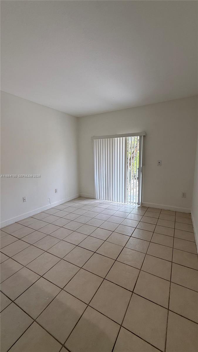11240 Southwest 230th Terrace, Unit 11240 Miami, FL 33170 - Photo 12 of 35 a view of an empty room and window