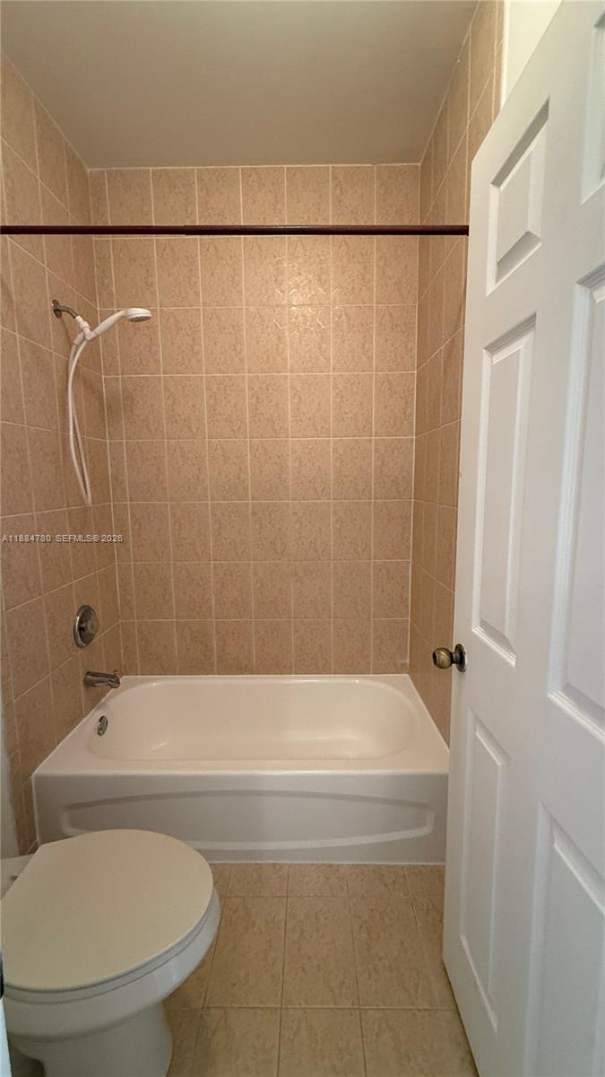 11240 Southwest 230th Terrace, Unit 11240 Miami, FL 33170 - Photo 20 of 35 a bathroom with a shower and a toilet