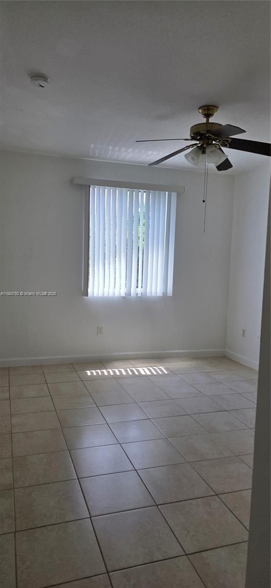 11240 Southwest 230th Terrace, Unit 11240 Miami, FL 33170 - Photo 2 of 9 a view of an empty room with a window