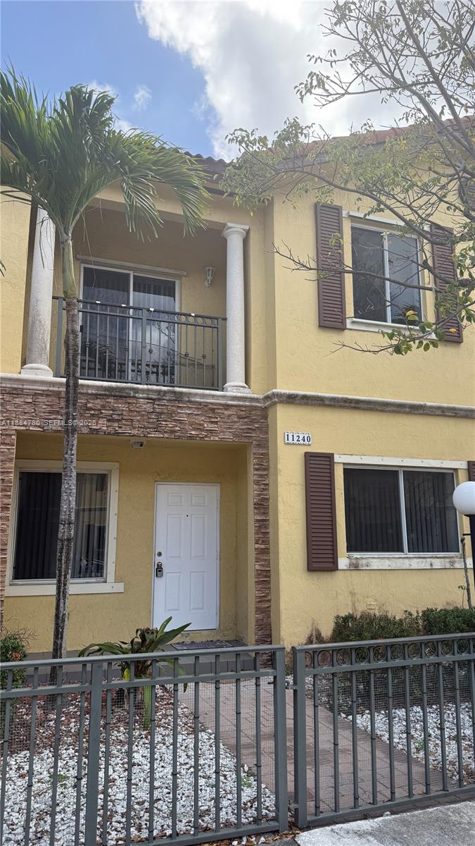 11240 Southwest 230th Terrace, Unit 11240 Miami, FL 33170 - Photo 2 of 35 a front view of a house
