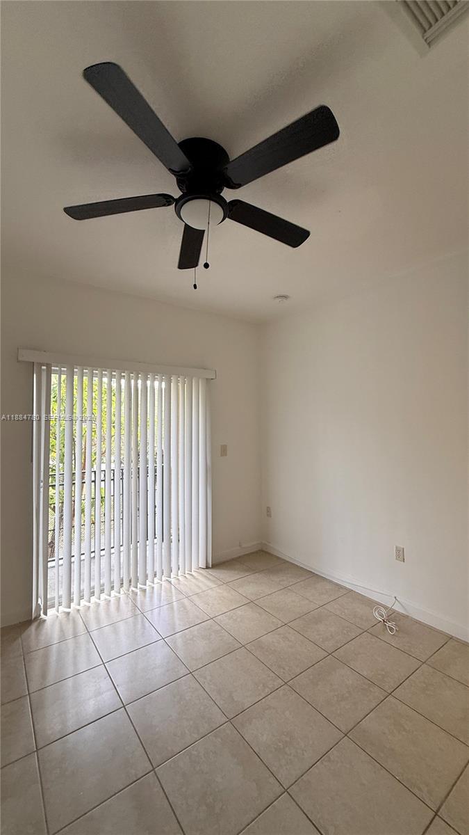 11240 Southwest 230th Terrace, Unit 11240 Miami, FL 33170 - Photo 25 of 35 a view of an empty room with a window