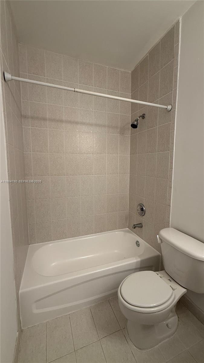 11240 Southwest 230th Terrace, Unit 11240 Miami, FL 33170 - Photo 29 of 35 a bathroom with a toilet and a bath tub