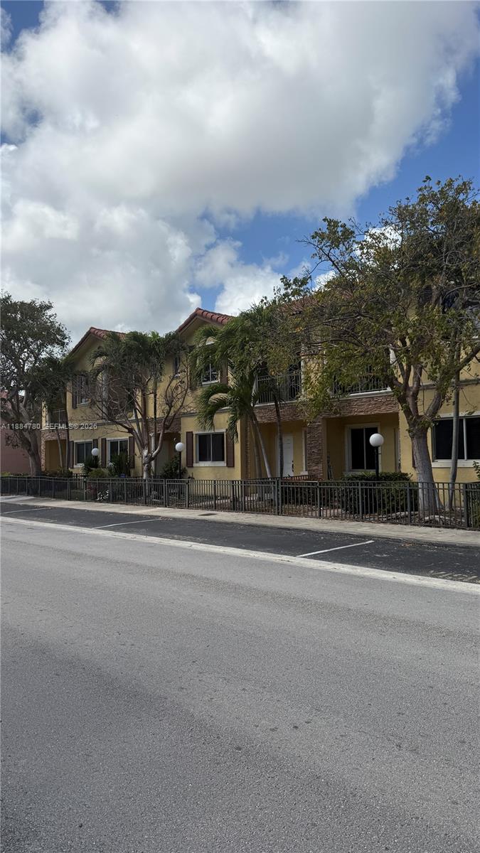 11240 Southwest 230th Terrace, Unit 11240 Miami, FL 33170 - Photo 34 of 35 front view of a house with a street