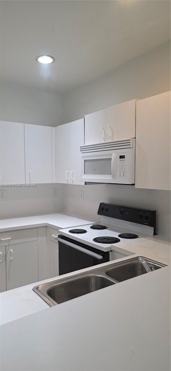 11240 Southwest 230th Terrace, Unit 11240 Miami, FL 33170 - Photo 4 of 9 a close view of appliances in kitchen