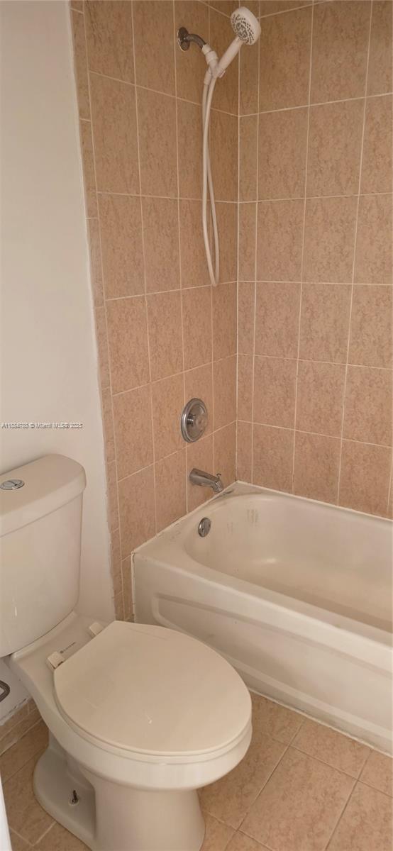 11240 Southwest 230th Terrace, Unit 11240 Miami, FL 33170 - Photo 8 of 9 a bathroom with a toilet and a bathtub