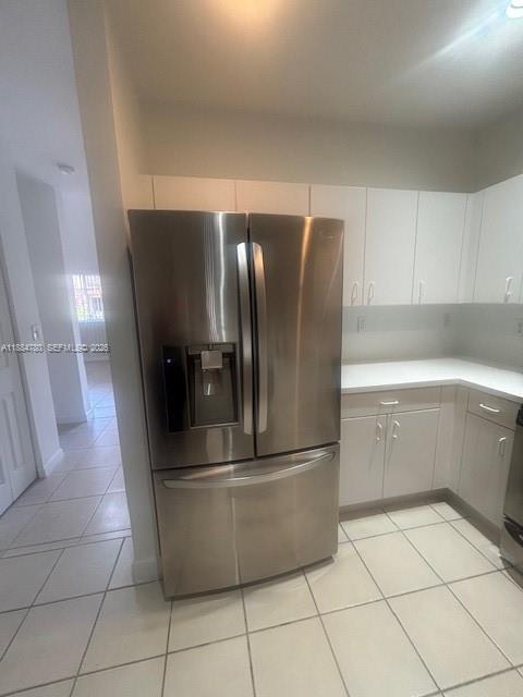 11240 Southwest 230th Terrace, Unit 11240 Miami, FL 33170 - Photo 9 of 35 a metallic refrigerator freezer sitting in a kitchen
