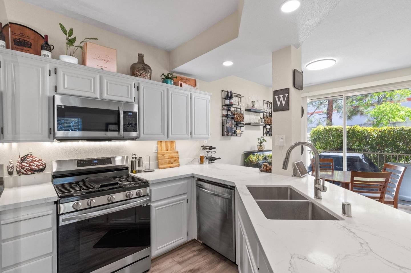 3337 Midtown Place San Jose, CA 95136 - Photo 11 of 32 a kitchen with stainless steel appliances a stove sink and microwave
