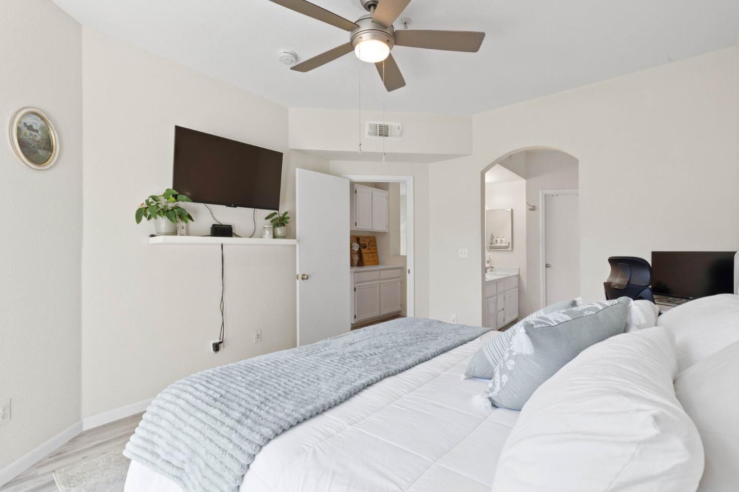 3337 Midtown Place San Jose, CA 95136 - Photo 17 of 32 a bedroom with a bed and a flat screen tv