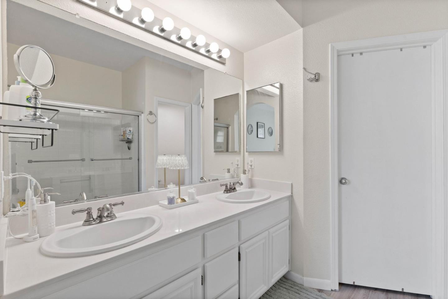 3337 Midtown Place San Jose, CA 95136 - Photo 18 of 32 a bathroom with a double vanity sink and a mirror