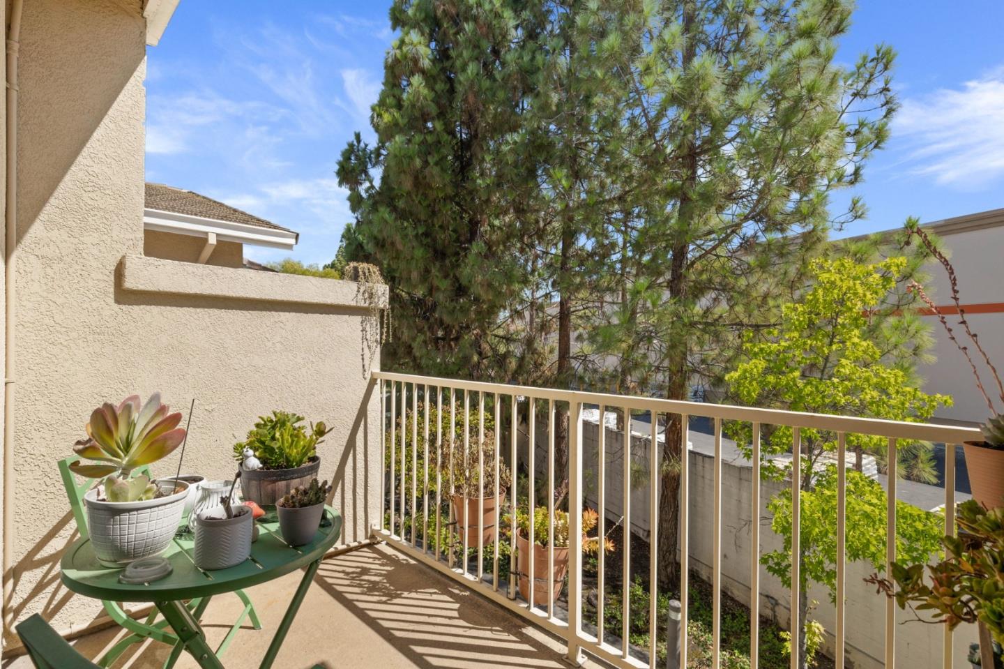 3337 Midtown Place San Jose, CA 95136 - Photo 23 of 32 a view of a balcony with chair and potted plants
