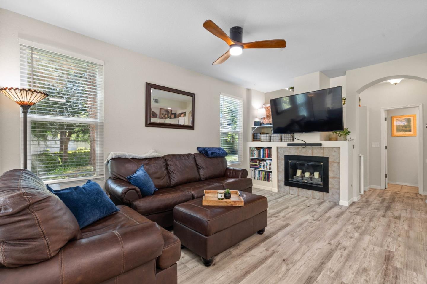 3337 Midtown Place San Jose, CA 95136 - Photo 4 of 32 a living room with furniture a fireplace and a flat screen tv