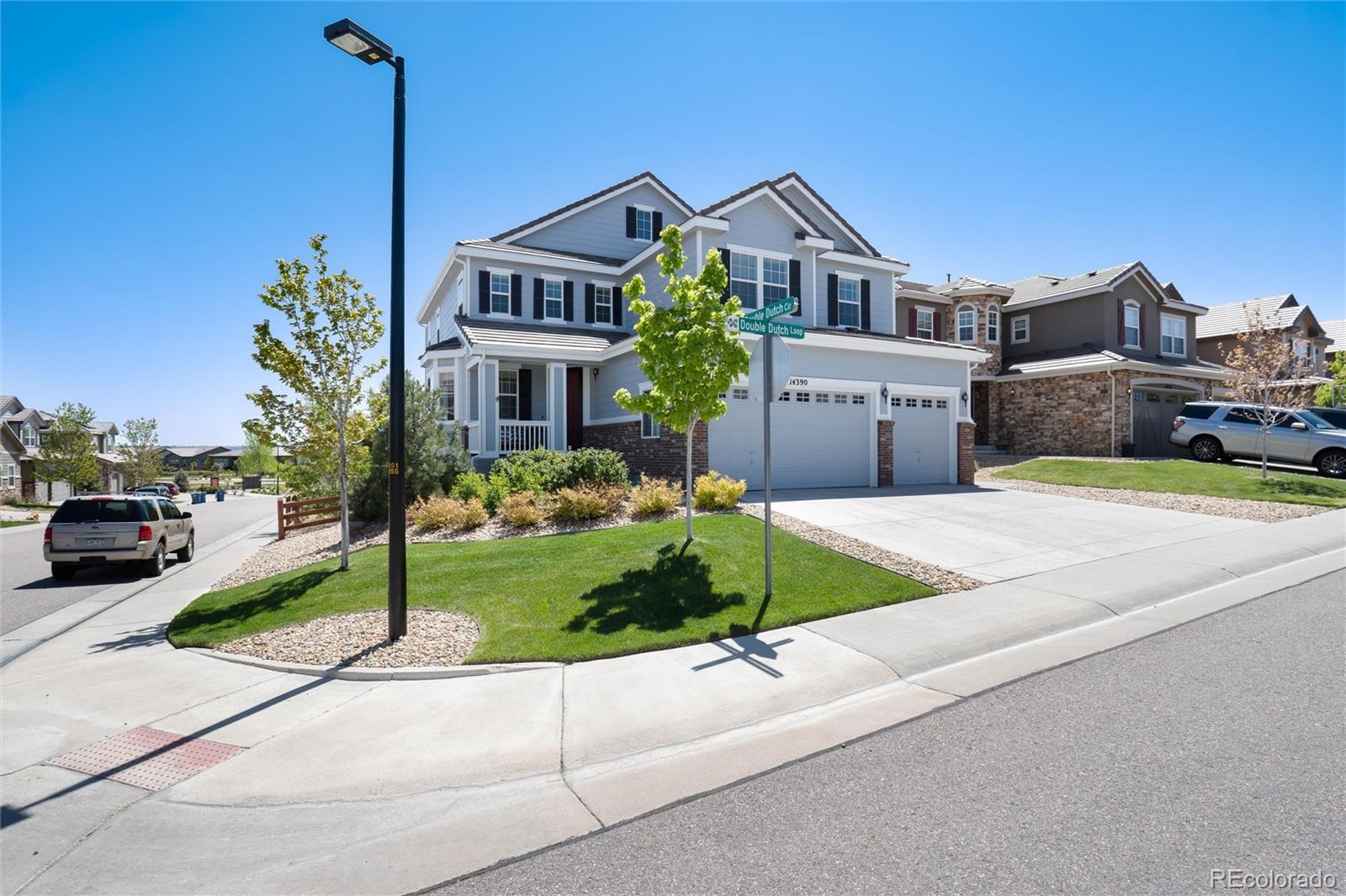 14390 Double Dutch Loop Parker, CO 80134 - Photo 2 of 50 a front view of a house with a garden and yard