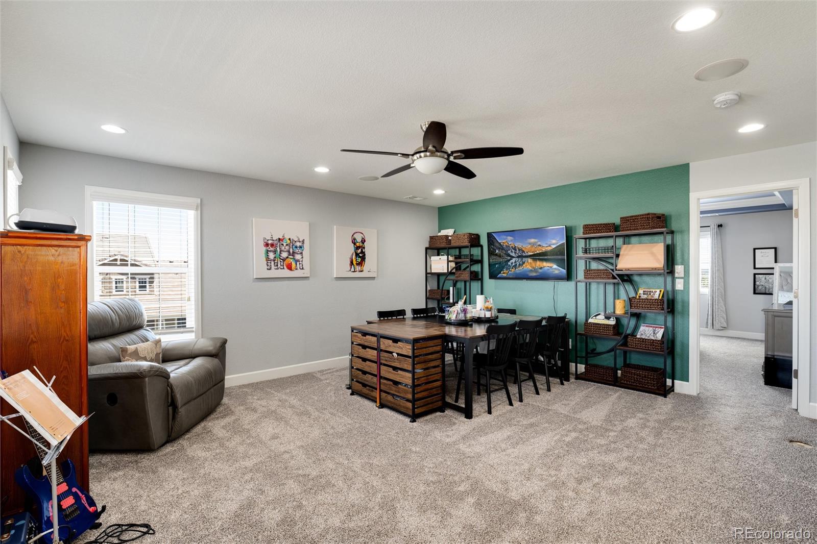 14390 Double Dutch Loop Parker, CO 80134 - Photo 23 of 50 a living room with furniture a ceiling fan and a window