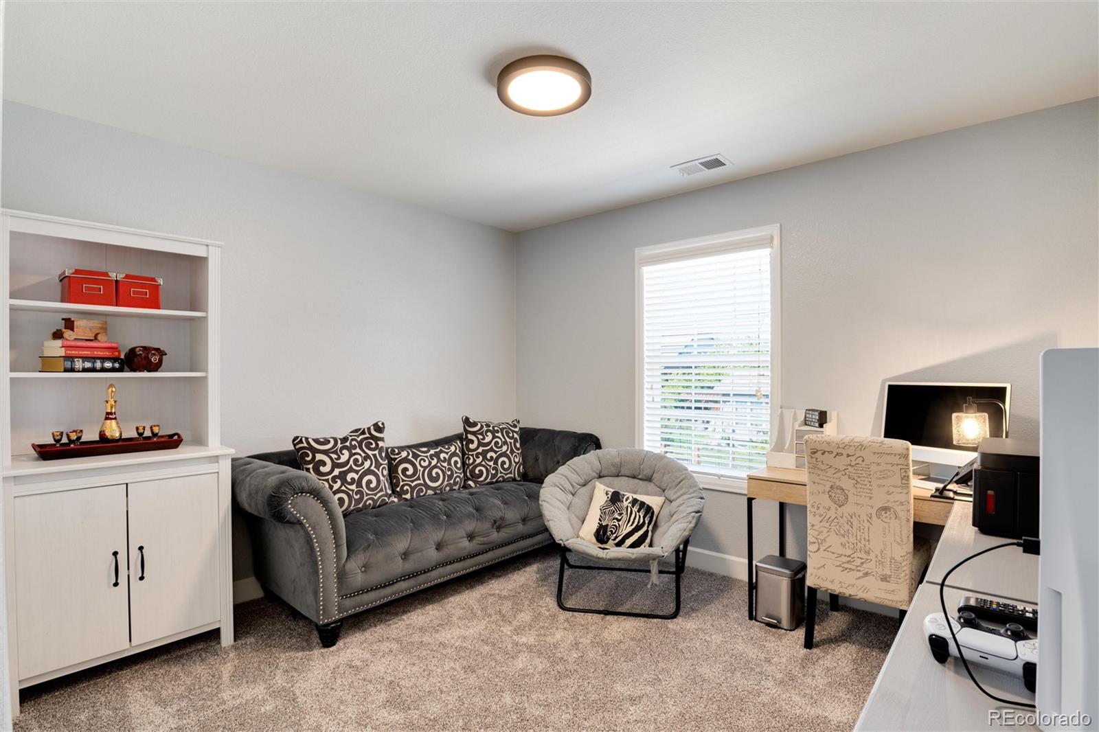 14390 Double Dutch Loop Parker, CO 80134 - Photo 31 of 50 a living room with furniture and a window