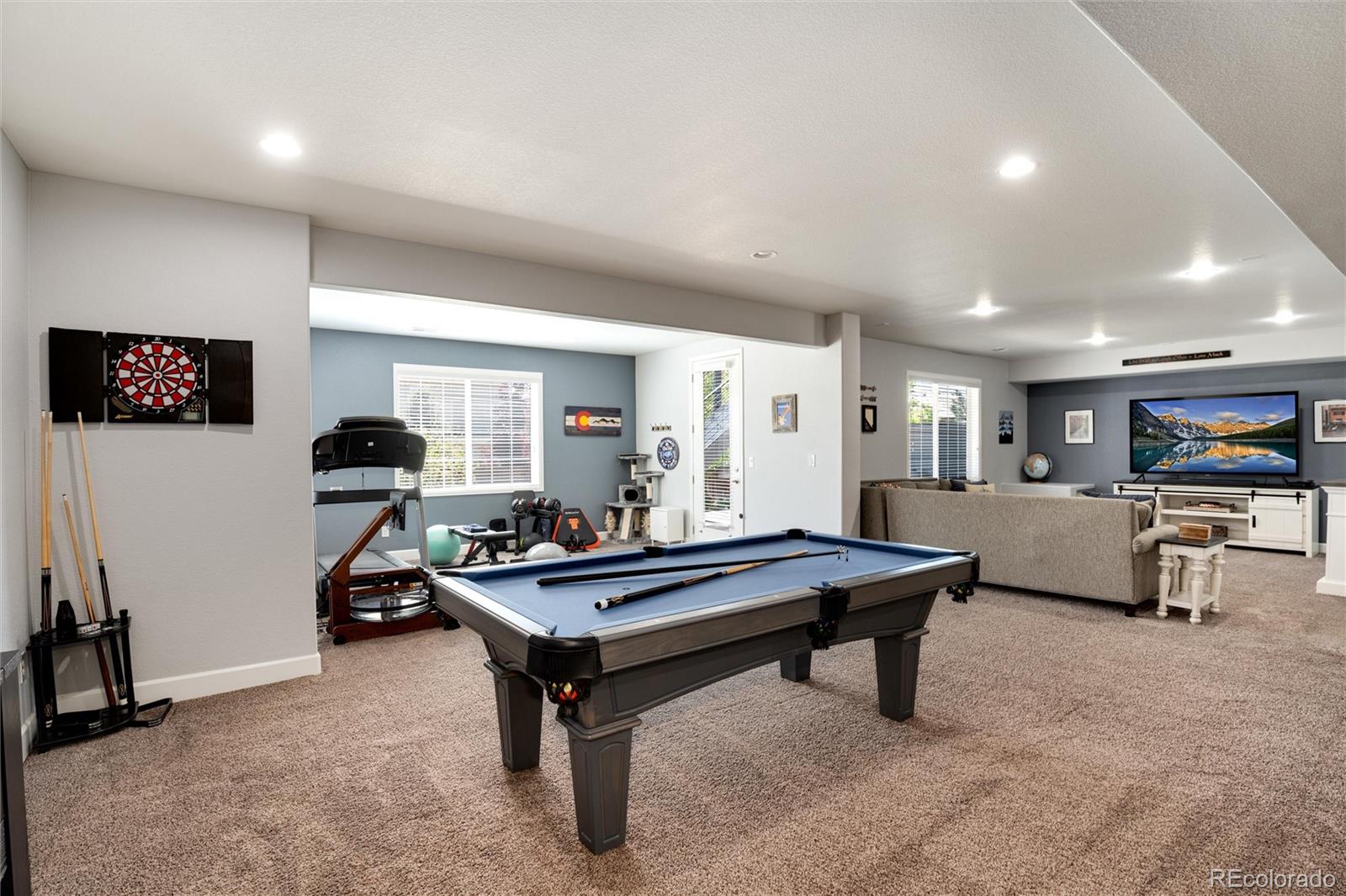 14390 Double Dutch Loop Parker, CO 80134 - Photo 35 of 50 a living room with furniture and a flat screen tv