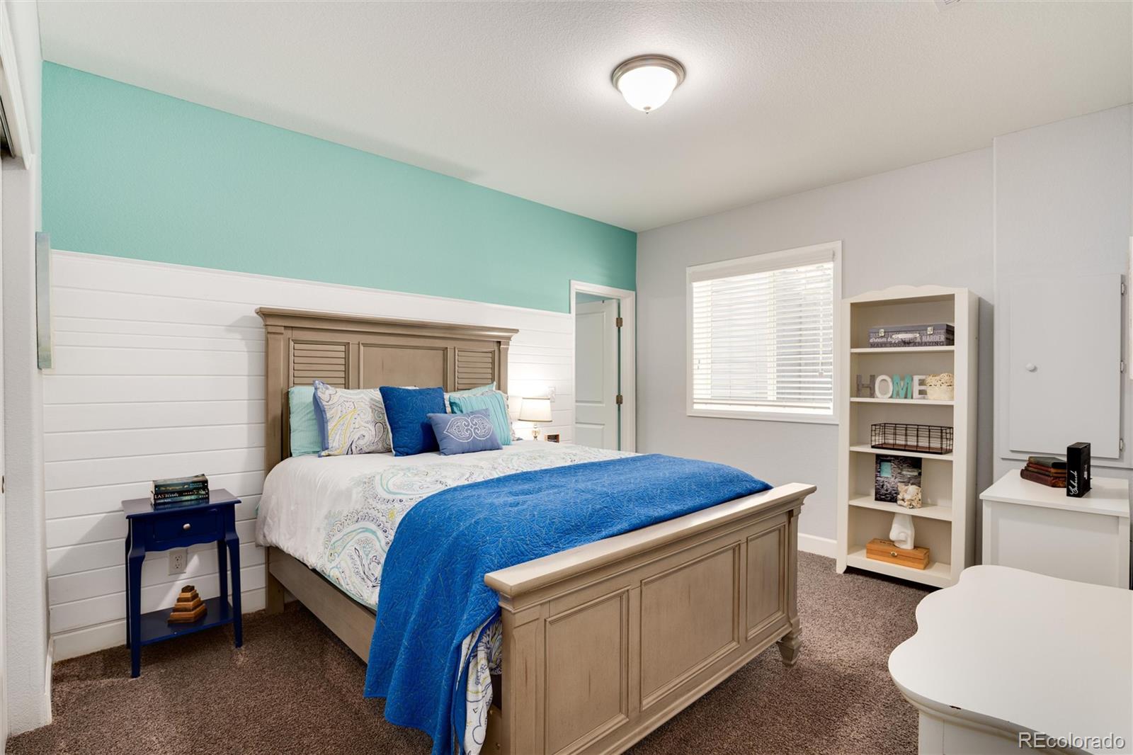 14390 Double Dutch Loop Parker, CO 80134 - Photo 40 of 50 a bedroom with a bed and a cabinets