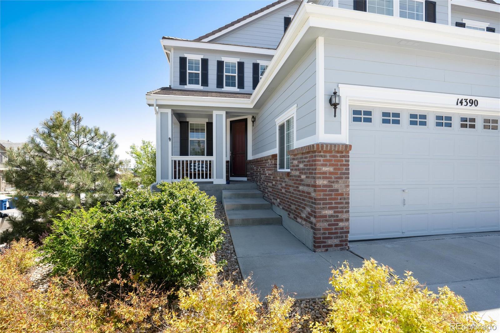 14390 Double Dutch Loop Parker, CO 80134 - Photo 4 of 50 a front view of a house with a yard