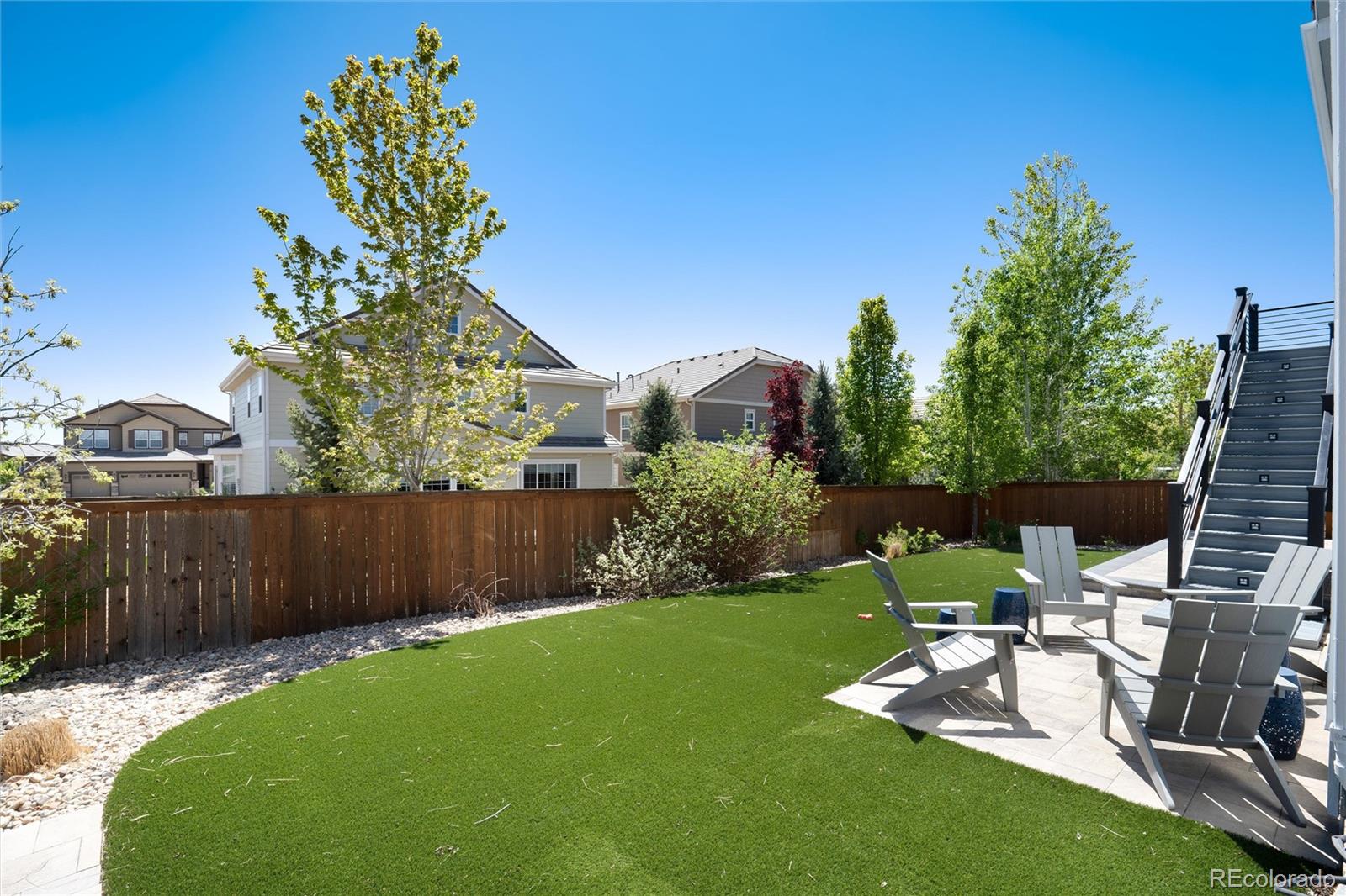 14390 Double Dutch Loop Parker, CO 80134 - Photo 48 of 50 a view of a chair and table in backyard of the house