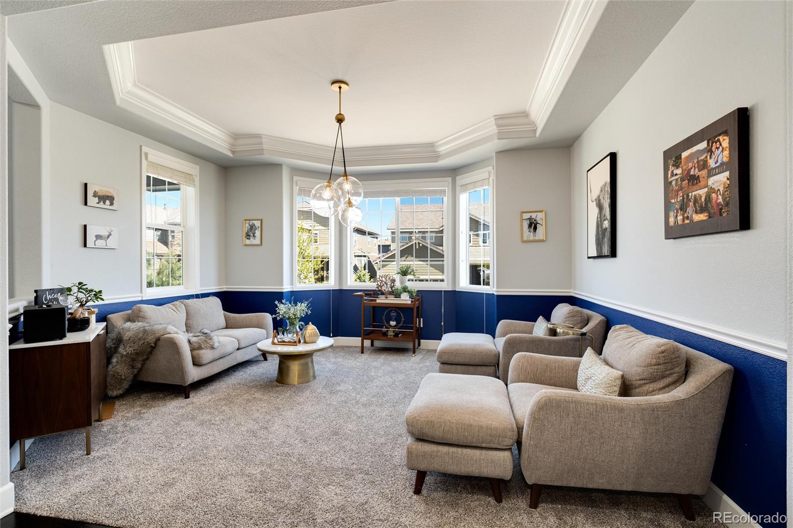 14390 Double Dutch Loop Parker, CO 80134 - Photo 8 of 50 a living room with furniture and a chandelier
