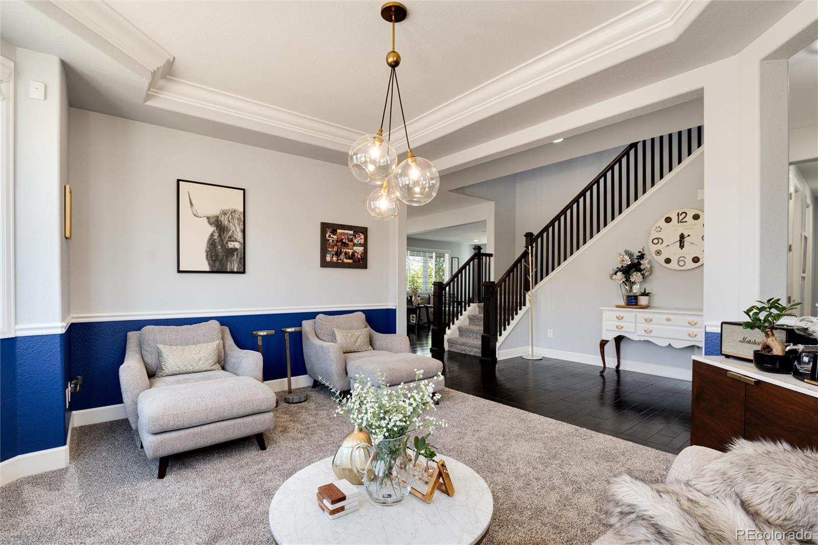 14390 Double Dutch Loop Parker, CO 80134 - Photo 9 of 50 a living room with furniture and a chandelier