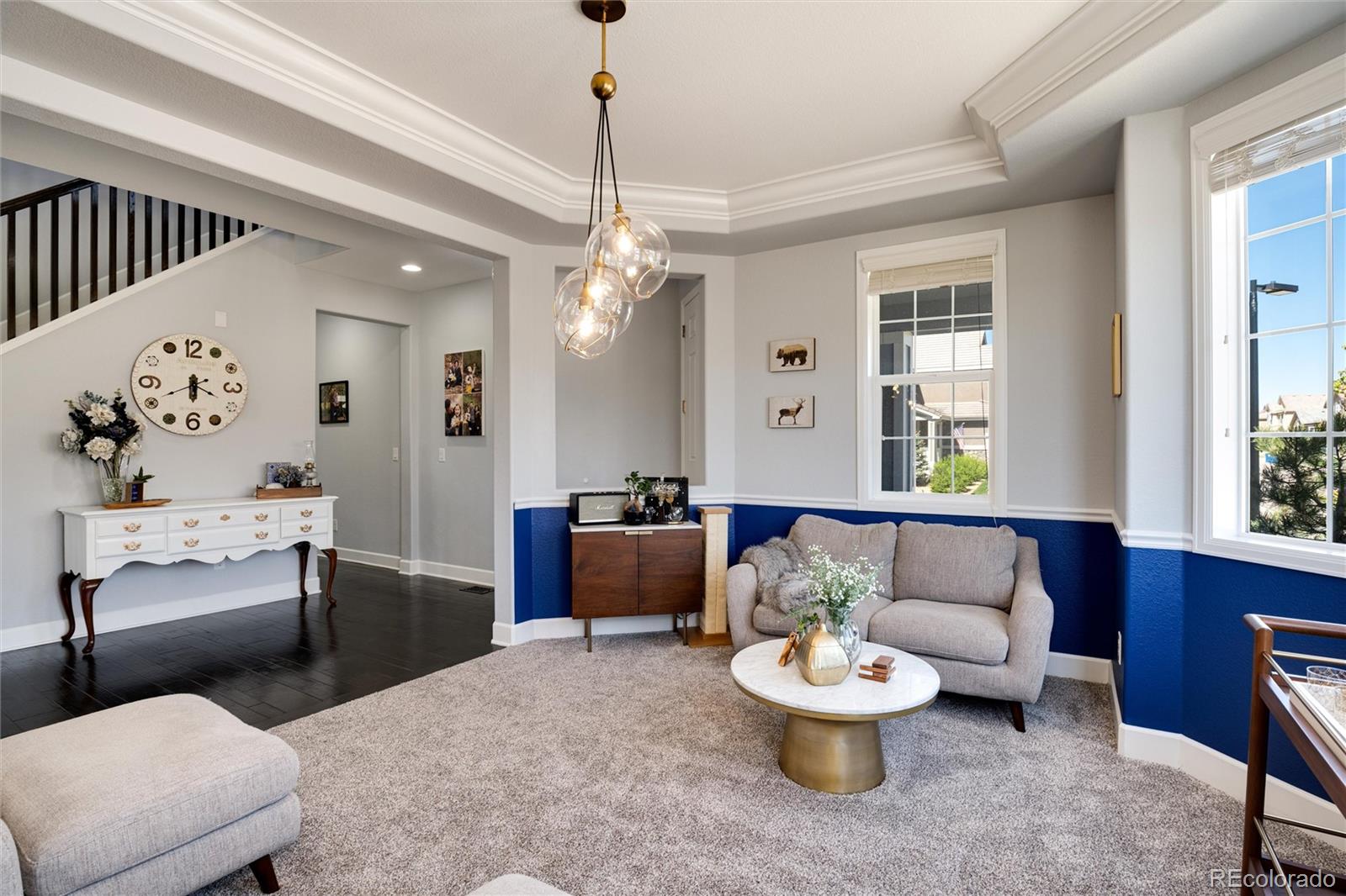 14390 Double Dutch Loop Parker, CO 80134 - Photo 10 of 50 a living room with furniture and a chandelier