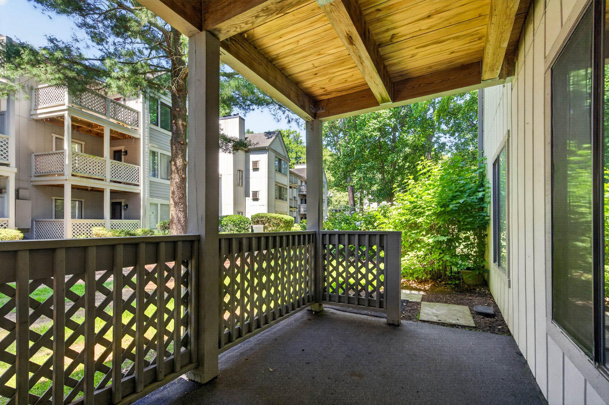 2281 Hunter's Run Drive, Unit 2281 Reston, VA 20191 - Photo 14 of 25 Serene porch with lush greenery views.