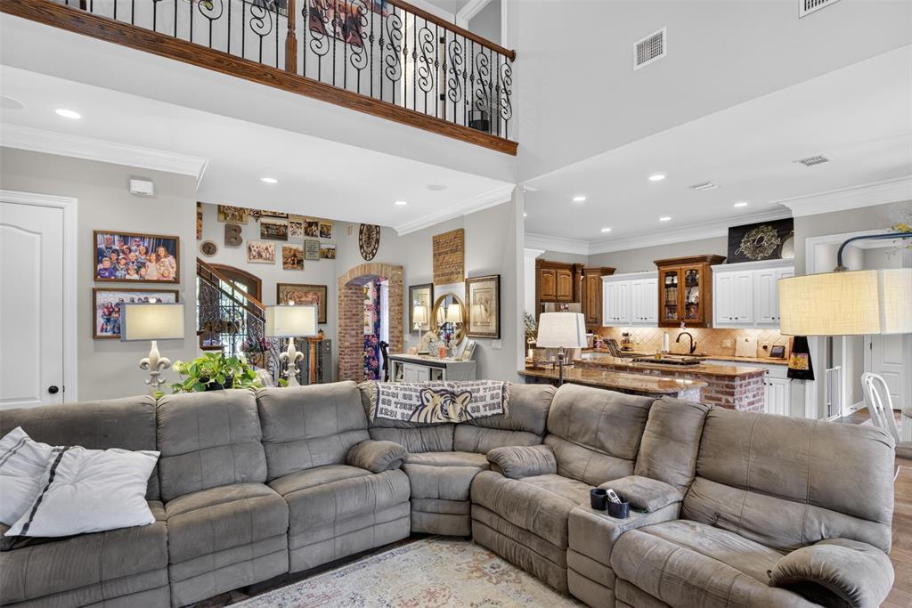 11868 Timber Ridge Drive Keithville, LA 71047 - Photo 8 of 37 Spacious living area featuring a vaulted ceiling and an open-concept design