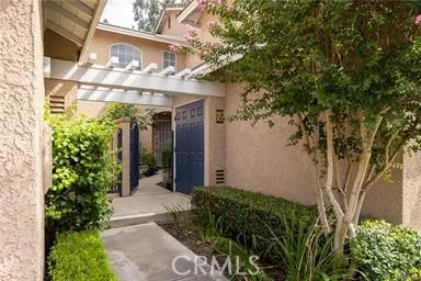front view of a house with a tree