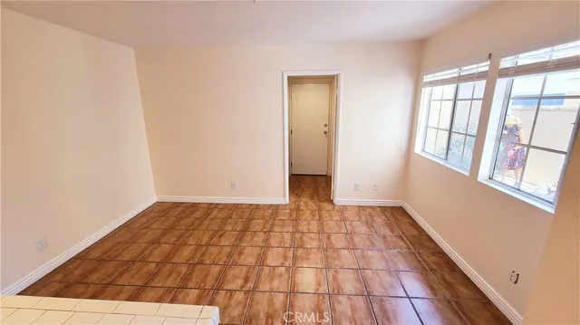 a view of an empty room and wooden floor