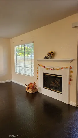 a view of a room with wooden floor and stairs