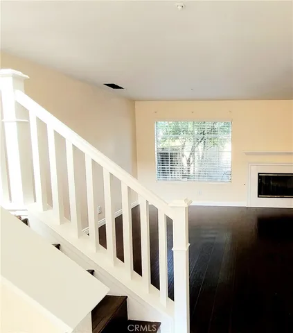 a view of an entryway with wooden floor