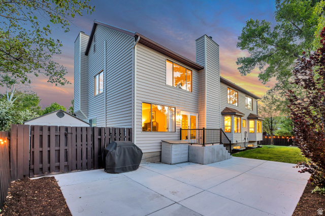 1837 Richard Road Sandy, UT 84093 - Photo 50 of 67 Rear exterior featuring light-colored siding and a concrete patio