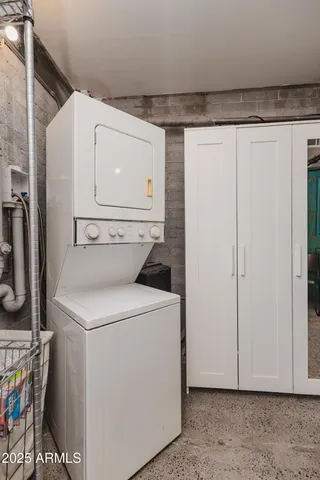 a kitchen with a refrigerator and a sink