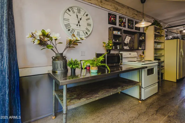 a kitchen with a refrigerator and stove