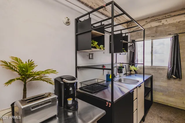 a kitchen with a stove and cabinets