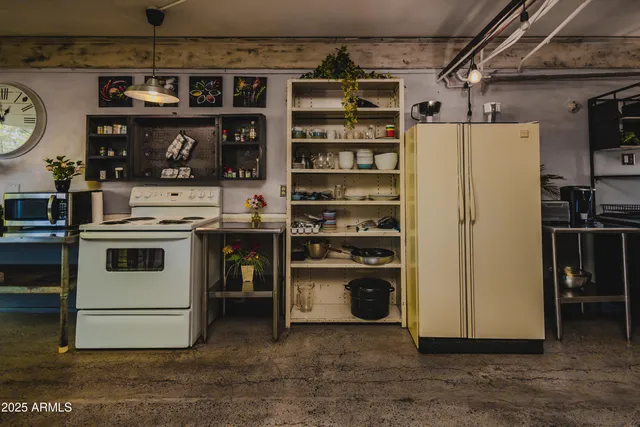 a white stove top oven sitting inside of a kitchen
