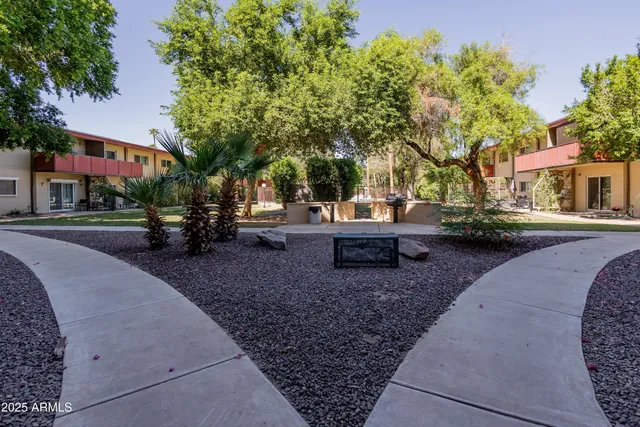 a view of yard with swimming pool and green space