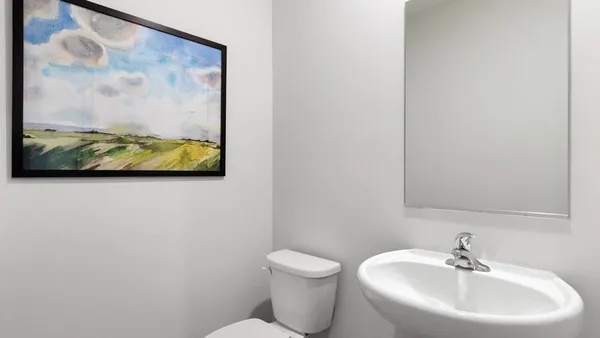 a bathroom with a toilet and a sink