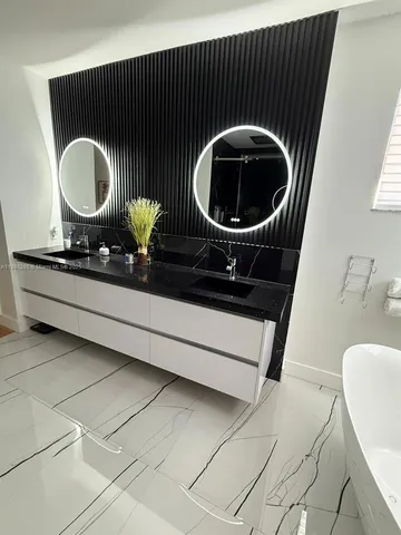 a utility room with a sink a washer and dryer