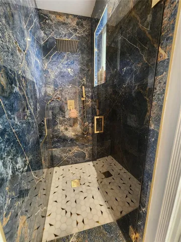 a bedroom with a bed and a walk in closet