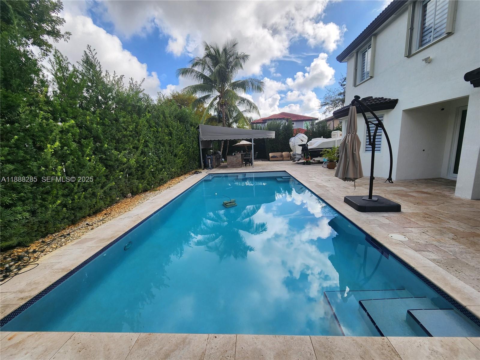 16411 Southwest 60th Terrace Miami, FL 33193 - Photo 24 of 37 a view of a pool with a patio