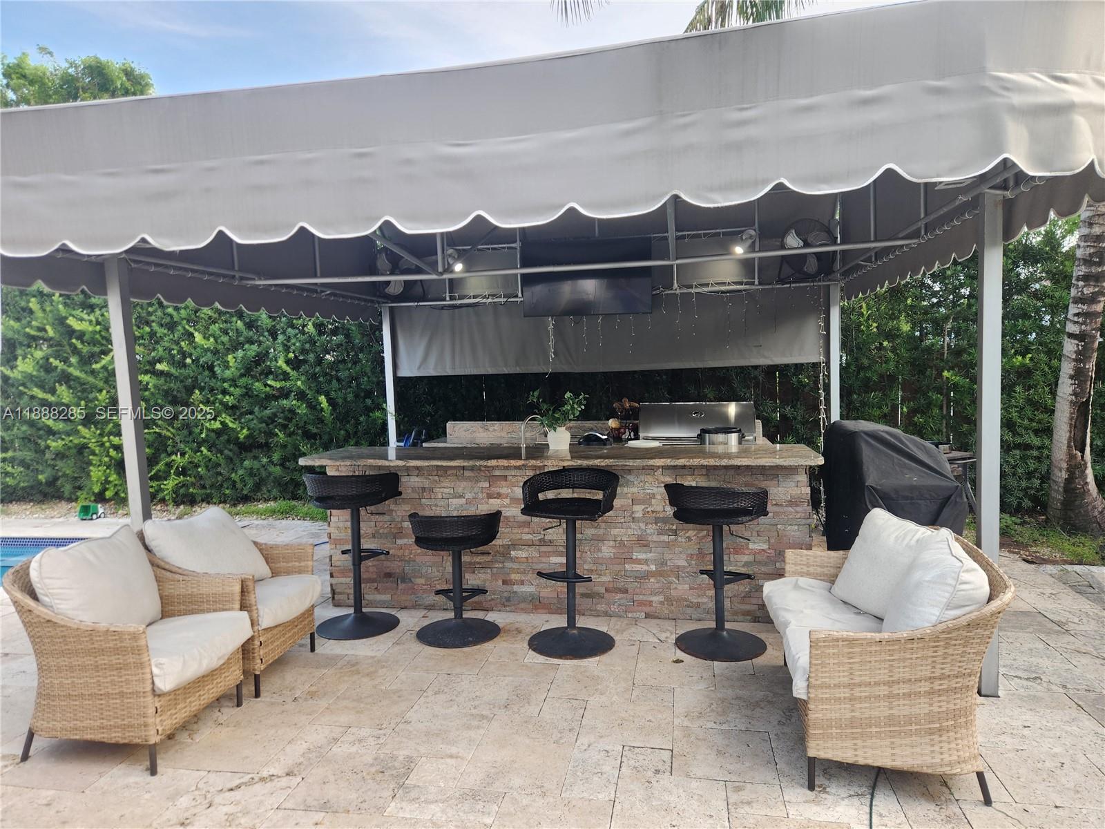 16411 Southwest 60th Terrace Miami, FL 33193 - Photo 26 of 37 a view of a patio with couches chairs and a potted plant