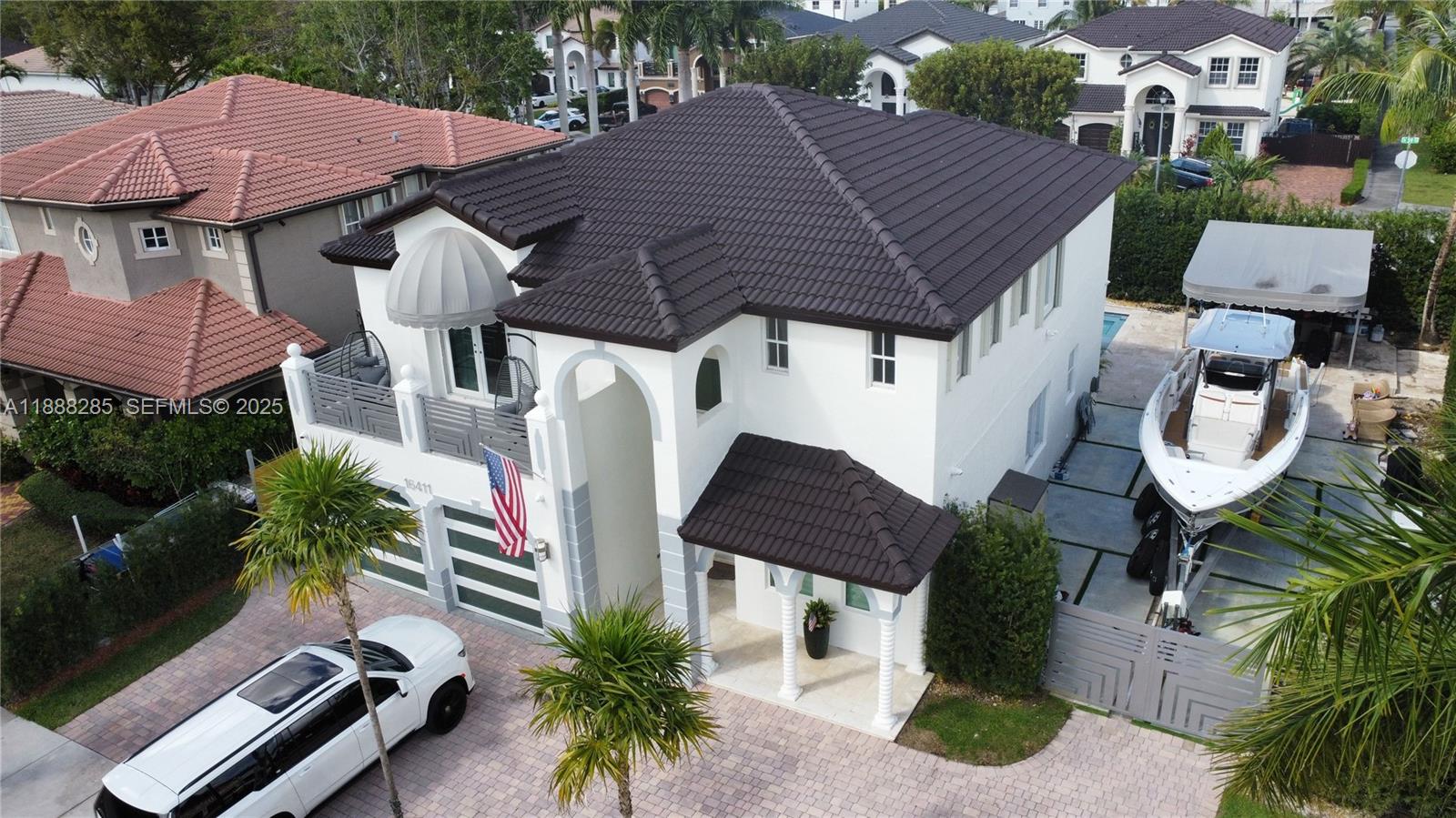 16411 Southwest 60th Terrace Miami, FL 33193 - Photo 27 of 37 an aerial view of a house with garden space and street view