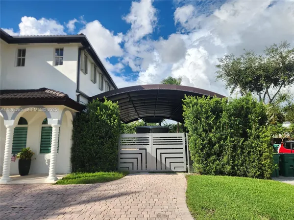 an aerial view of a house with garden and patio