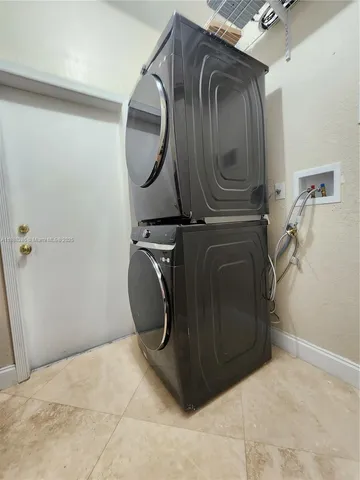 a view of a chairs and table in patio