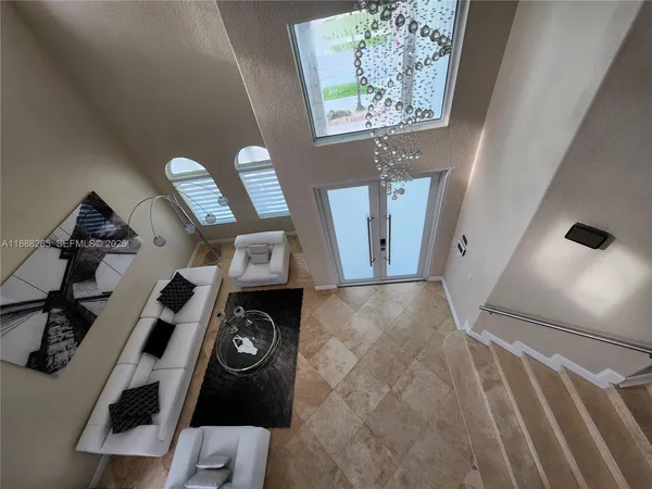 a view of living room with furniture and air conditioner vent
