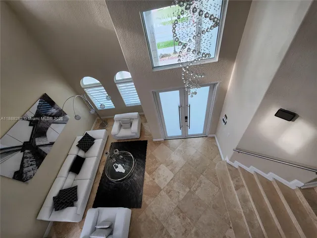 a view of living room with furniture and air conditioner vent