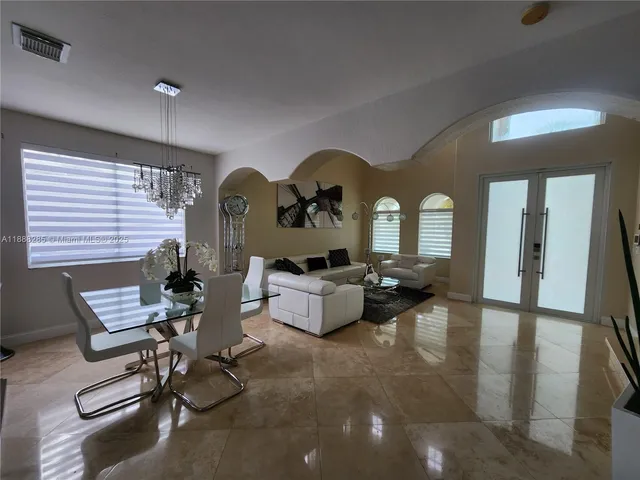 a living room with furniture and white walls