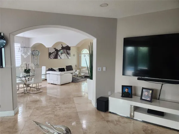 a living room with furniture and a flat screen tv