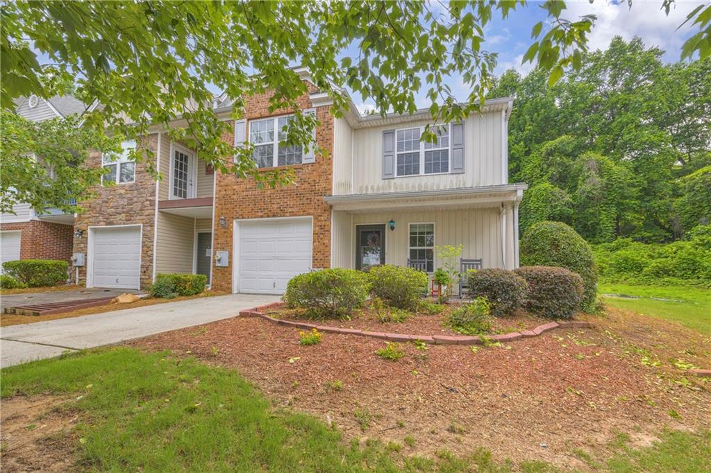 1498 Box Circle Winder, GA 30680 - Photo 1 of 56 a front view of a house with a yard and potted plants